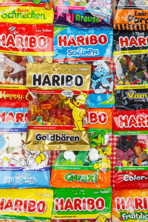 Stuttgart, Germany - March 7, 2021: Haribo gummy bear gummi candy candies different types variety background portrait format in Stuttgart, Germany.のeditorial素材