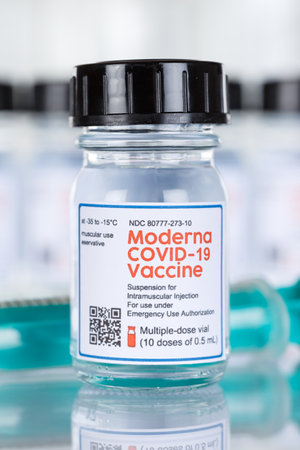 Stuttgart, Germany - March 19, 2021: Moderna Coronavirus Vaccine Corona Virus COVID-19 Covid syringe vaccines portrait format in Germany.のeditorial素材