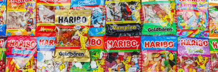 Stuttgart, Germany - March 7, 2021: Haribo gummy bear gummi candy candies different types variety background banner in Stuttgart, Germany.のeditorial素材
