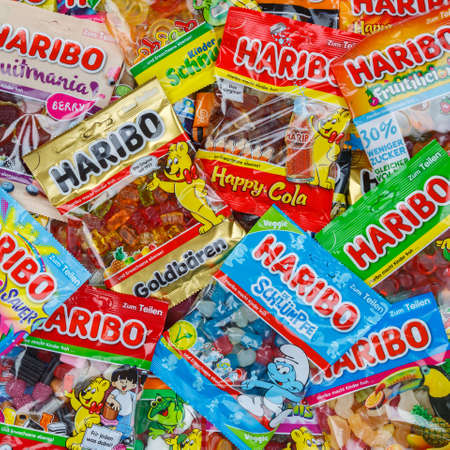 Stuttgart, Germany - March 7, 2021: Haribo gummy bear gummi candy candies different types variety background square in Stuttgart, Germany.のeditorial素材