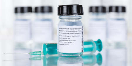 Stuttgart, Germany - March 19, 2021: Biontech Pfizer Coronavirus Vaccine Corona Virus COVID-19 Covid syringe vaccines copyspace copy space banner in Germany.のeditorial素材
