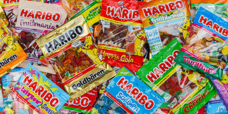 Stuttgart, Germany - March 7, 2021: Haribo gummy bear gummi candy candies different types variety background banner in Stuttgart, Germany.のeditorial素材