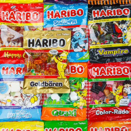 Stuttgart, Germany - March 7, 2021: Haribo gummy bear gummi candy candies different types variety background square in Stuttgart, Germany.のeditorial素材