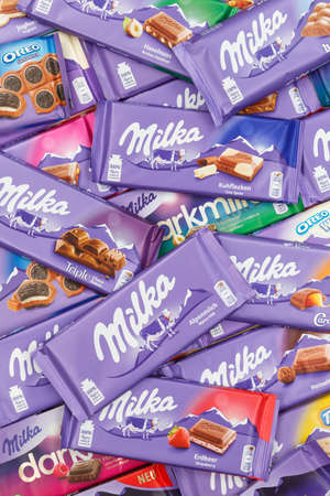 Stuttgart, Germany - March 3, 2021: Milka chocolate chocolates different types variety background portrait format in Germany.のeditorial素材