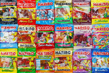 Stuttgart, Germany - March 7, 2021: Haribo gummy bear gummi candy candies different types variety background in Stuttgart, Germany.のeditorial素材