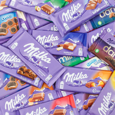 Stuttgart, Germany - March 3, 2021: Milka chocolate chocolates different types variety background square in Germany.のeditorial素材