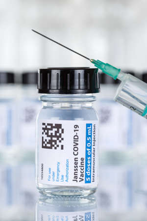 Stuttgart, Germany - March 19, 2021: Johnson & Johnson Coronavirus Vaccine Corona Virus COVID-19 Covid syringe vaccines portrait format in Germany.のeditorial素材