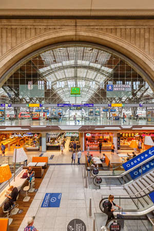 Leipzig, Germany - August 19, 2020: Leipzig main railway station Hauptbahnhof Hbf Deutsche Bahn DB hall shops portrait format in Germany.のeditorial素材