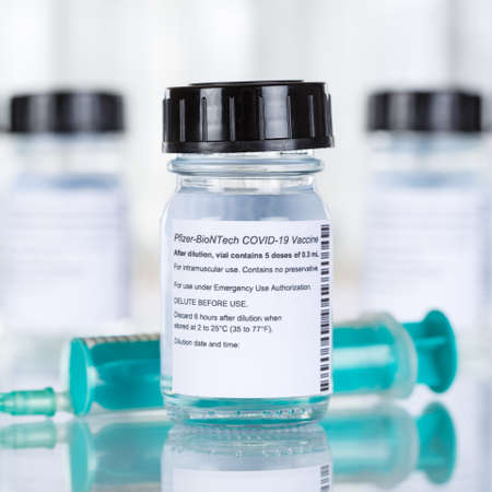 Stuttgart, Germany - March 19, 2021: Biontech Pfizer Coronavirus Vaccine Corona Virus COVID-19 Covid syringe vaccines square in Germany.のeditorial素材