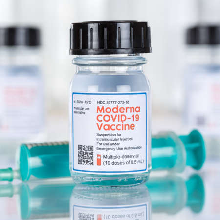 Stuttgart, Germany - March 19, 2021: Moderna Coronavirus Vaccine Corona Virus COVID-19 Covid syringe vaccines square in Germany.のeditorial素材