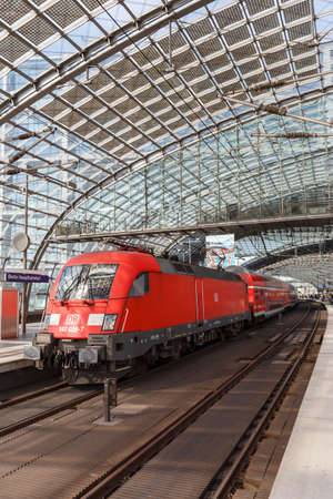 Berlin, Germany - August 20, 2020: Suburban regional train at Berlin main railway station Hauptbahnhof Hbf portrait format in Germany.のeditorial素材