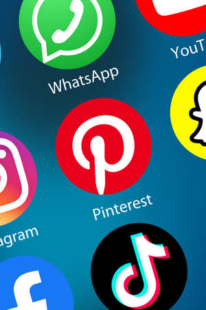 Stuttgart, Germany - April 5, 2021: Pinterest logo social media icon marketing network on the internet background portrait format in Stuttgart, Germany.のeditorial素材