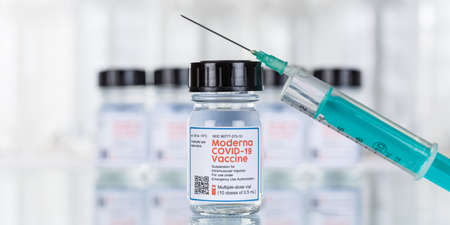 Stuttgart, Germany - March 19, 2021: Moderna Coronavirus Vaccine Corona Virus COVID-19 Covid syringe vaccines copyspace copy space banner in Germany.のeditorial素材