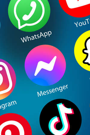 Stuttgart, Germany - April 5, 2021: Facebook Messenger logo social media icon marketing network on the internet background portrait format in Stuttgart, Germany.のeditorial素材