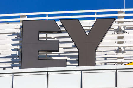 Stuttgart, Germany - December 19, 2020: Ernst & Young EY logo headquarter HQ at Stuttgart airport in Germany.のeditorial素材
