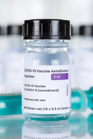 Stuttgart, Germany - March 19, 2021: AstraZeneca Coronavirus Vaccine Corona Virus COVID-19 Covid syringe vaccines portrait format in Germany.のeditorial素材