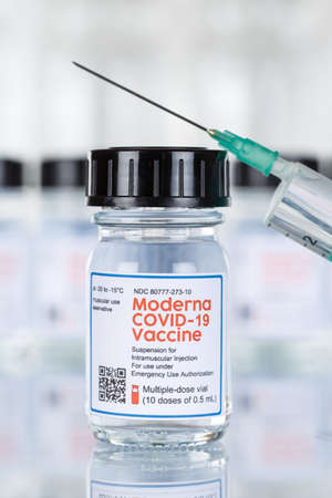 Stuttgart, Germany - March 19, 2021: Moderna Coronavirus Vaccine Corona Virus COVID-19 Covid syringe vaccines portrait format in Germany.のeditorial素材