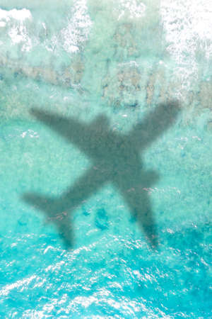 Travel traveling vacation sea symbolic picture airplane flying copyspace copy space Seychelles portrait format water imageの写真素材