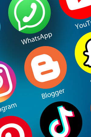 Stuttgart, Germany - April 5, 2021: Blogger Logo Blog blogging logo icon marketing network on the internet background portrait format in Stuttgart, Germany.のeditorial素材