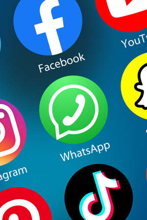 Stuttgart, Germany - April 5, 2021: WhatsApp Messenger Message logo social media icon marketing network on the internet background portrait format in Stuttgart, Germany.のeditorial素材