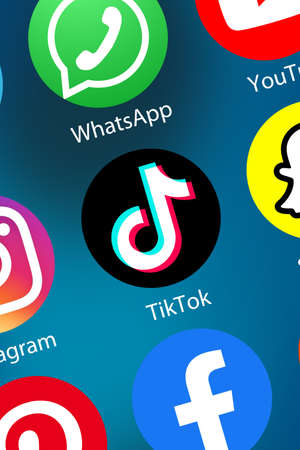 Stuttgart, Germany - April 5, 2021: TikTok Tik Tok logo social media icon marketing network on the internet background portrait format in Stuttgart, Germany.のeditorial素材