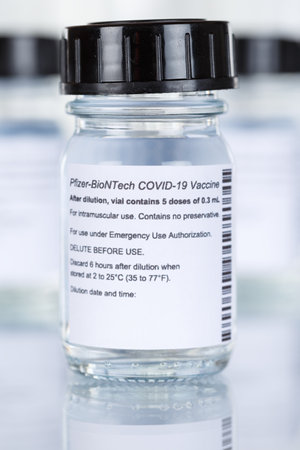 Stuttgart, Germany - March 19, 2021: Biontech Pfizer Coronavirus Vaccine Corona Virus COVID-19 Covid vaccines portrait format in Germany.のeditorial素材