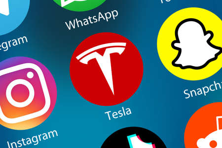 Stuttgart, Germany - April 5, 2021: Tesla company App logo icon on the internet background in Stuttgart, Germany.のeditorial素材