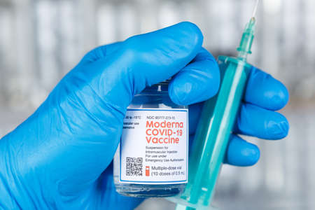 Stuttgart, Germany - March 19, 2021: Moderna Coronavirus Vaccine Corona Virus COVID-19 Covid syringe vaccines in Germany.のeditorial素材