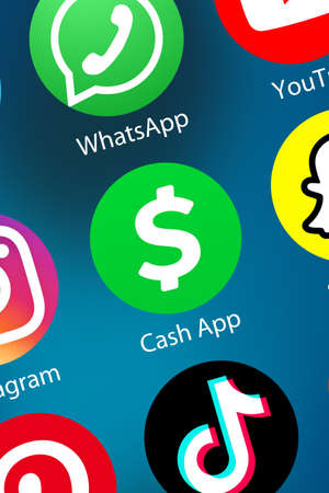Stuttgart, Germany - April 5, 2021: Cash App logo money transfer pay paying icon mobile payment service on the internet background portrait format in Stuttgart, Germany.のeditorial素材