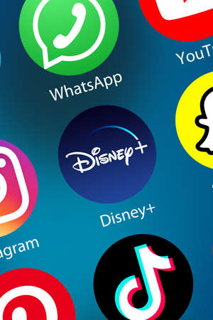 Stuttgart, Germany - April 5, 2021: Disney+ Disney Plus movie Video Streaming logo icon on the internet background portrait format in Stuttgart, Germany.のeditorial素材