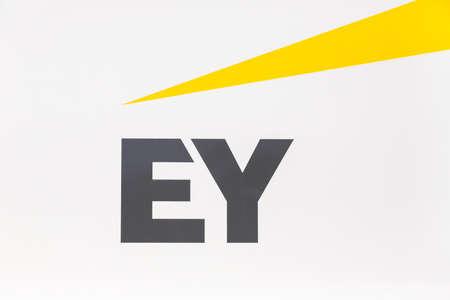Stuttgart, Germany - December 19, 2020: Ernst & Young EY logo headquarter HQ at Stuttgart airport in Germany.のeditorial素材