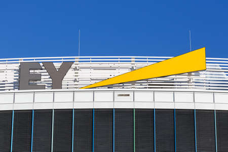 Stuttgart, Germany - December 19, 2020: Ernst & Young EY logo headquarter HQ at Stuttgart airport in Germany.のeditorial素材