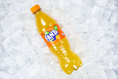 Stuttgart, Germany - August 31, 2021: Fanta orange lemonade soft drink in a plastic bottle on ice cubes in Stuttgart, Germany.のeditorial素材