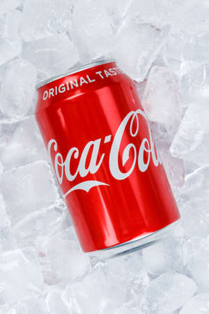 Stuttgart, Germany - August 31, 2021: Coca Cola Coca-Cola in a can lemonade soft drink on ice cubes portrait format in Stuttgart, Germany.のeditorial素材