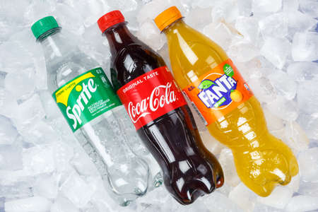 Stuttgart, Germany - August 31, 2021: Coca Cola Coca-Cola Fanta Sprite lemonade drinks in plastic bottles on ice cubes in Stuttgart, Germany.のeditorial素材