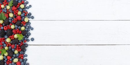 Berries fruits berry fruit strawberries strawberry blueberries blueberry with copyspace copy space panorama on wooden board summerの写真素材