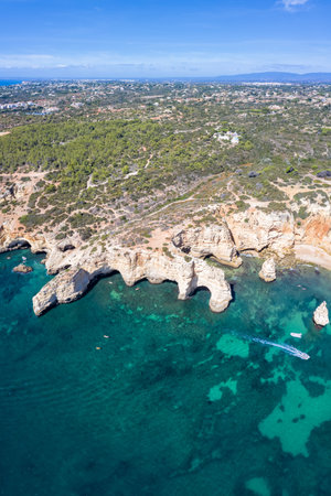 Portugal Algarve beach Praia da Marinha sea ocean drone view aerial photo from above portrait format waterの写真素材