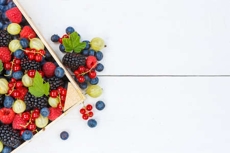 Berries fruits berry fruit strawberries strawberry blueberries blueberry with copyspace copy space in a box summerの写真素材