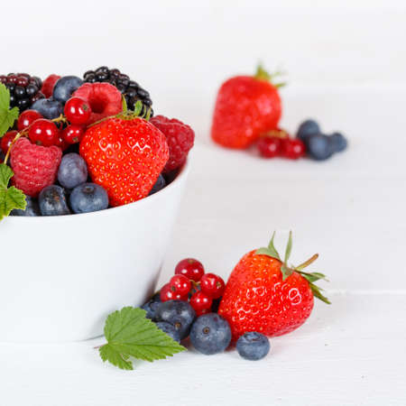 Berries fruits berry fruit strawberries strawberry blueberries blueberry on wooden board square summerの写真素材