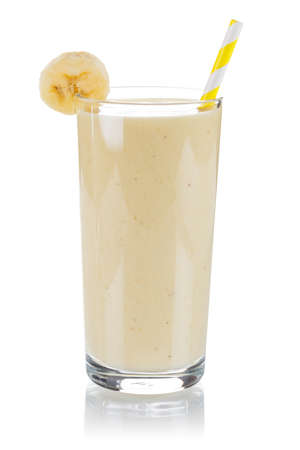 Banana fruit juice smoothie fresh drink in a glass isolated on a white backgroundの写真素材