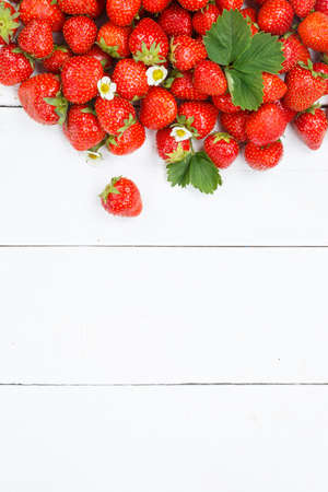 Strawberries berries fruits strawberry berry fruit with copyspace copy space on a wooden board portrait format summerの写真素材