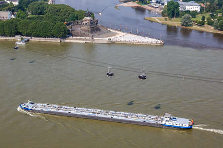 Koblenz Deutsches Eck German Corner Rhine Mosel river with ships boats and cable car in Germany travelの写真素材
