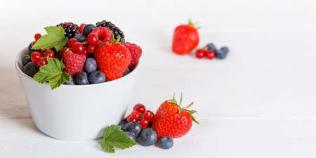 Berries fruits berry fruit strawberries strawberry blueberries blueberry on wooden board copyspace copy space panorama summerの写真素材