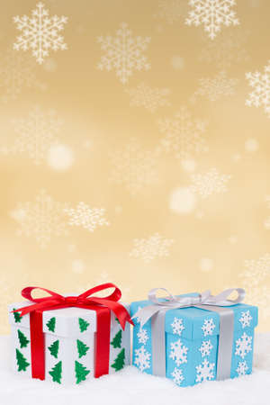 Christmas gifts gold decoration snow snowing portrait format copyspace copy space goldenの写真素材