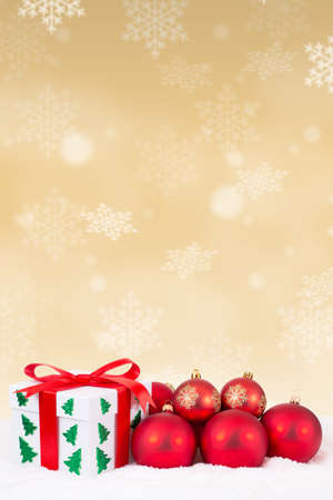 Christmas card gift present gold decoration gifts winter snow snowing balls portrait format surpriseの写真素材
