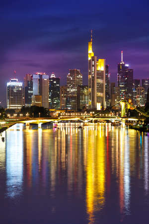 Frankfurt skyline with Main river skyscraper portrait format in Germany twilightの写真素材