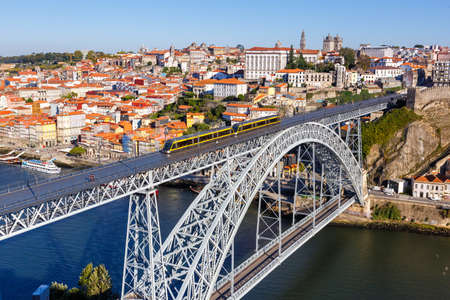 Porto Portugal with bridge Ponte Dom Luis I Douro river with tram town travel travelingの写真素材