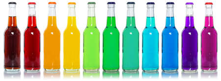 Drinks lemonade cola drink many soft drinks bottles in a row isolated on a white backgroundの写真素材