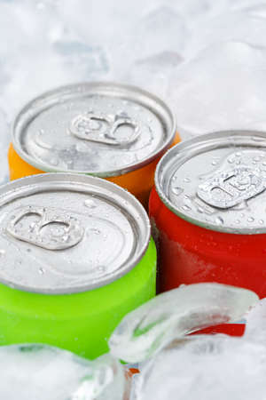 Drinks lemonade cola drink soft drinks in cans with ice cubes portrait format sodaの写真素材