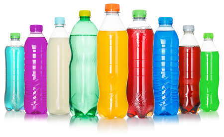 Drinks lemonade cola drink many soft drinks bottles in a row bottle isolated on whiteの写真素材